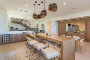 a large kitchen with a large island in a room at Element Denver International Airport in Denver