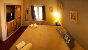 a bedroom with a large bed in a room at HOPA-Home Patagonia Hostel in San Carlos de Bariloche