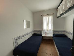 Postel nebo postele na pokoji v ubytování ERMITA by SOM Menorca