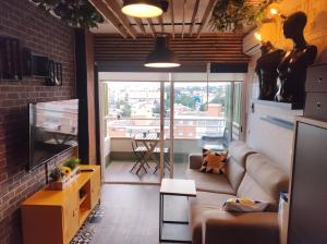 TV a/nebo společenská místnost v ubytování Saltillo Alto Boutique Studio