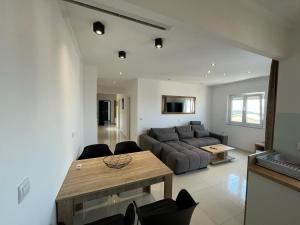 a living room with a couch and a table at Apartments Pivac in Makarska