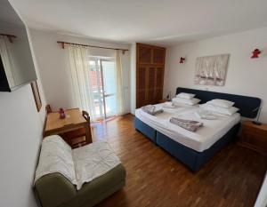 Postel nebo postele na pokoji v ubytování Apartments Šuda