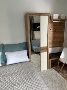 a bedroom with a bed and a mirror at Old Town Lucky Star Split in Split