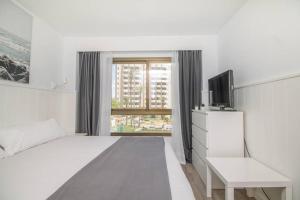 Postel nebo postele na pokoji v ubytování Ocean House Bloque 3 Planta 1 By IVI Real Estate + 20 fotografií