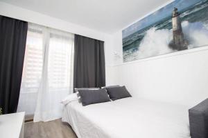 Postel nebo postele na pokoji v ubytování Ocean House Bloque 3 Planta 1 By IVI Real Estate
