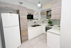 Kuchyň nebo kuchyňský kout v ubytování Lili's Apartment + 19 fotografií