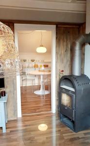 a living room with a fireplace and a table at Geschmackvolle Wohnung 65qm in Solingen NRW in Solingen