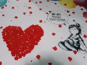 a drawing of a girl and a bunch of hearts at Apartamentos Ohana in Jadraque