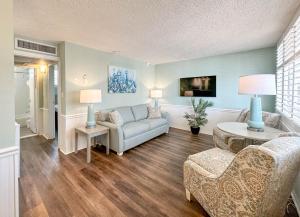 a living room with a couch and a table at Thunderbird Beach Resort in St Pete Beach