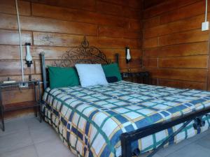 Voodi või voodid majutusasutuse Cabaña en Villa Amancay toas