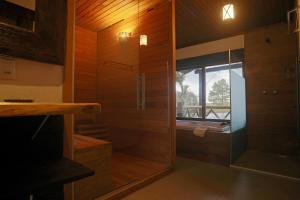a bathroom with a shower and a glass door at Aires de Patagonia in Cambara do Sul +142 photos