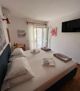 Postel nebo postele na pokoji v ubytování Apartments Šuda