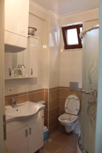 a bathroom with a sink and a toilet at Konaklar Apart Premium in Trabzon +90 photos