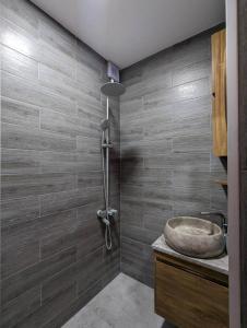 a bathroom with a sink and a tub at DATI in Borjomi