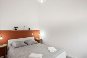 Postel nebo postele na pokoji v ubytování MontSéjour - Logement Climatisé Netflix, Mezzanine