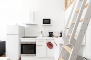 Kuchyň nebo kuchyňský kout v ubytování MontSéjour - Logement Climatisé Netflix, Mezzanine + 14 fotografií