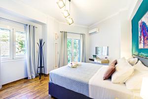 Posteľ alebo postele v izbe v ubytovaní Ionian Citizen Suite