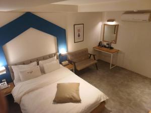 Postel nebo postele na pokoji v ubytování Hotel Yaja Hwajeong Station