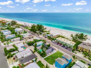 an aerial view of the beach and buildings at The Retreat at Anna Maria Island Inn in Bradenton Beach