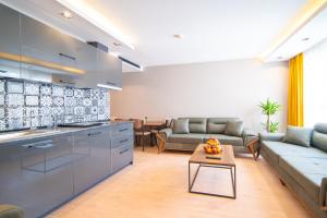 a kitchen and living room with a couch and a table at Garden Room Otel in Istanbul