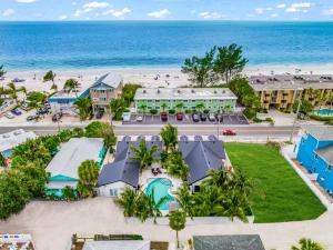 an aerial view of a resort with the beach at The Retreat at Anna Maria Island Inn in Bradenton Beach