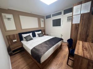 Voodi või voodid majutusasutuse Amber Hotel toas