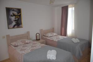 Un pat sau paturi într-o cameră la Guest House Ilto
