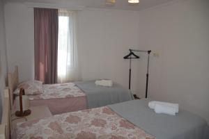 Un pat sau paturi într-o cameră la Guest House Ilto