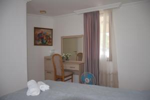 Un pat sau paturi într-o cameră la Guest House Ilto