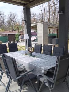 a table and chairs on a patio at Apartmán Kocka na prízemí in Šaštín