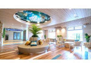 a lobby with a large room with a plant at La'gent Hotel Okinawa Chatan Hotel and Hostel - Vacation STAY 59138v in Fuenzan