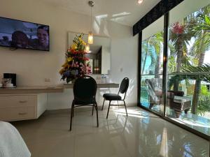 TV a/nebo společenská místnost v ubytování Hotel Plaza Caribe