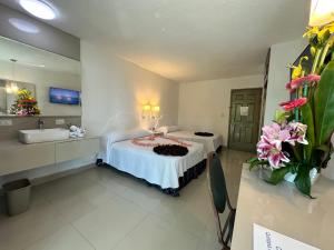 Postel nebo postele na pokoji v ubytování Hotel Plaza Caribe