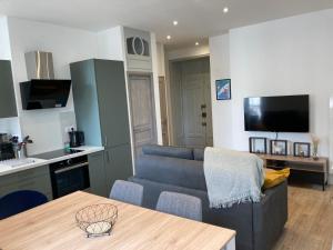 Kuchyňa alebo kuchynka v ubytovaní Les balcons du Sancy - Appartement neuf 3 étoiles