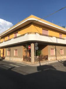 a building on the side of a street at Camere Lorenzo in Porto Cesareo