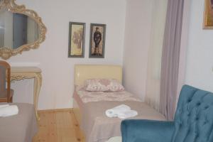 Un pat sau paturi într-o cameră la Guest House Ilto