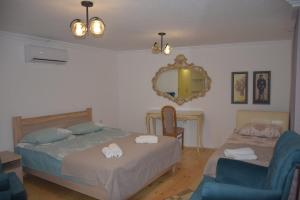 Un pat sau paturi într-o cameră la Guest House Ilto