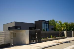 a building with a gate and a fence at FeelFree STAYS Basoa in Donostia-San Sebastián