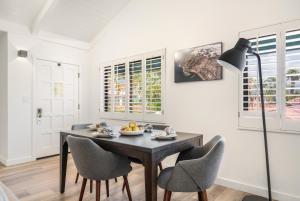 a dining room with a table and chairs at The Franciscan Hotel in Santa Barbara