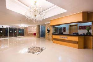 a lobby with a chandelier and a reception desk at Club Sun Paradise Hotel - All Inclusive in Avsallar +46 photos
