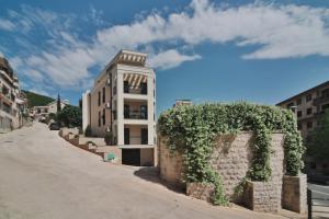 a building on the side of a street at Salus Hill Condo with private Garage in Budva
