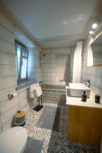 a bathroom with a sink and a toilet at Villa Calliope in Kalymnos