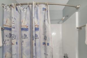 a shower curtain in a bathroom with a shower at The Dunes 502 by Vacation Homes Collection in Gulf Shores