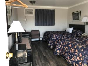 Ein Bett oder Betten in einem Zimmer der Unterkunft Tay Inn