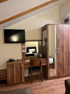 Kuchyň nebo kuchyňský kout v ubytování Amber Hotel