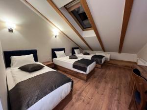 Voodi või voodid majutusasutuse Amber Hotel toas