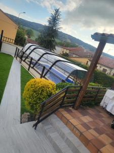 a wooden bench sitting on a set of stairs at ATAPUERCA RURAL SANSIL, con PISCINA in Atapuerca