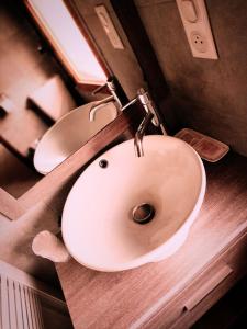 a bathroom with a white sink on a counter at Casa Stella in Olmeto