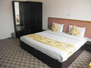 a bedroom with a large bed in a room at Norbooling HomeStay, Leh Ladakh in Leh