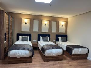 Voodi või voodid majutusasutuse Amber Hotel toas